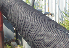 A pipeline protected by Trenton MCO outerwrap